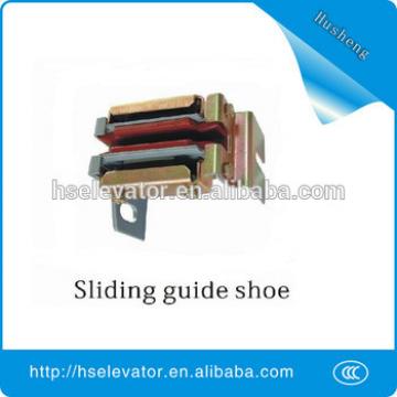 Sliding guide shoe, elevator guide shoe, elevator roller guide shoes